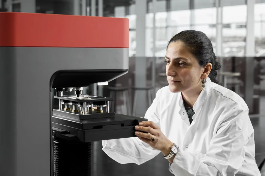 Hardness tester measuring a metal sample