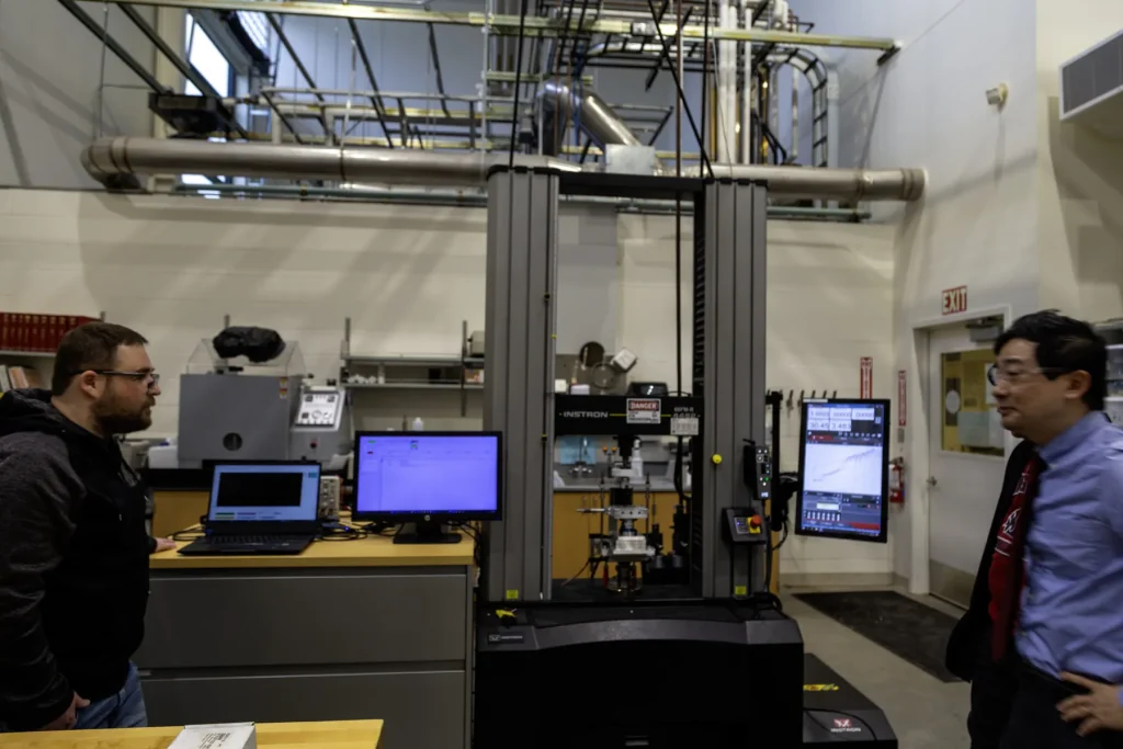 Students and staff in a university materials testing laboratory